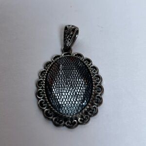 Oval Silver Pendant with net covering clear glass